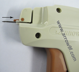 Keeping the needle locker in the same position, insert the new needle in the same slot, ensuring the slot on the needle matches the slot on the Tag Gun body, until it goes inside fully